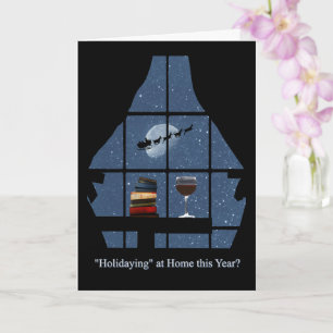 Wijn en boeken met kerstverblijf op de thuisfeestd kaart