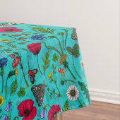 Wilde bloemen en motten op blauwgroen tafelkleed (Voorbeeld)