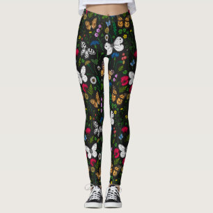 Wilde bloemen en vlinders op zwart leggings