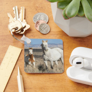 Wilde paarden thuis in het Sandwash-bekken Sleutelhanger