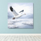 Wilde sneeuwgans vliegend in de winter canvas afdruk (Insitu (Houten vloer))