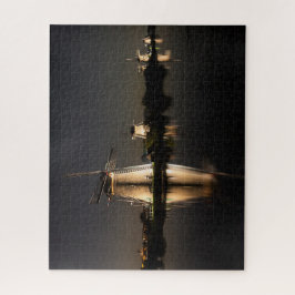 Windmills and water illuminated at night legpuzzel