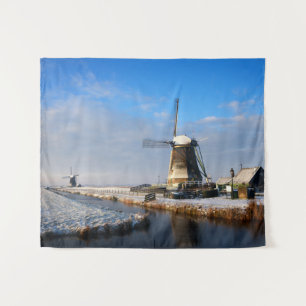 Windmolen in de sneeuw in een nederlands winterlan wandkleed