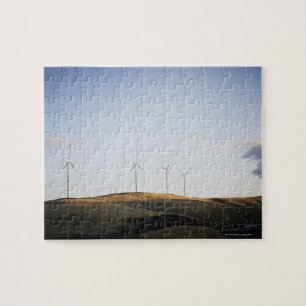 Windmolens op heuvel bij zonsondergang legpuzzel