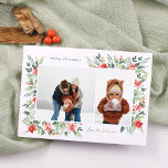 Winter Botanicals & Holly Merry Christmas 2 Foto Feestdagenkaart<br><div class="desc">Een stijlvol kerstfotokaartontwerp, met twee aangepaste foto's: een liggend en een portret, in een chique wit lijst. Het lijst is genesteld in het delicate waterverf gebladerte, waardoor een natuurlijke organische lay-out ontstaat. Het gebladerte bestaat uit weelderige groene bladeren en felrode bessen. Er zijn rode poinsettia bloemen en dennenboughs. Een traditioneel...</div>