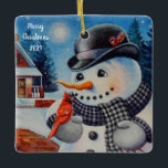 Winter Snowman en Red Cardinaal Bird Waterverf Art Keramisch Ornament<br><div class="desc">"Feathered Friend" Waterverf Art Ceramic Ornament by Artist Jean Weiner "Feathered Friend" is voorzien van een mannelijke Noordelijke Kardinaal vogel die op een sneeuwpop staat. De vogel en de sneeuwman lijken een vriendelijke groet met elkaar uit te wisselen. De sneeuwman draagt een zwart derby-pet en een warme zwarte en witte...</div>