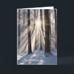 Winterbos met zonnestralen feestdagen kaart<br><div class="desc">Zonnestralen in winterbos met sneeuwvlokken voor Kerstmis</div>
