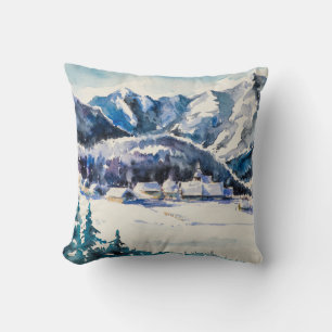 Winterlandschap met bergdorp bedekt met kussen
