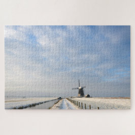 Winterlandschap met sneeuw en windmolen in Nederla Legpuzzel