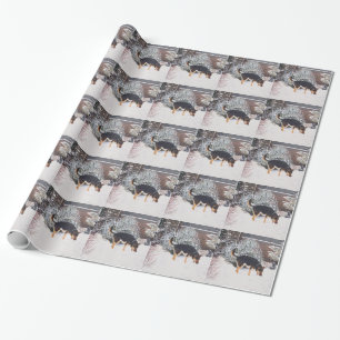Wintersneeuwscène met schattige zwarte en geelbru cadeaupapier