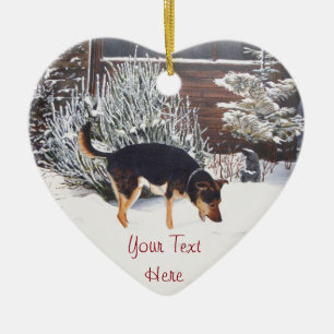 wintersneeuwscène met schattige zwarte en geelbrui keramisch ornament