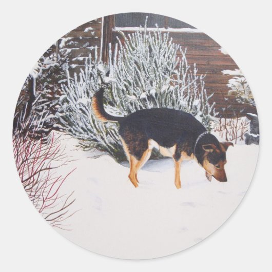 Wintersneeuwscène met schattige zwarte en geelbrui ronde sticker (Voorkant)