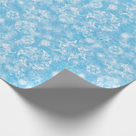 Wintersneeuwvlokken op lichtblauw cadeaupapier