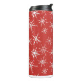 Wintersneeuwvlokken op rood thermosbeker (Gedraaid links)