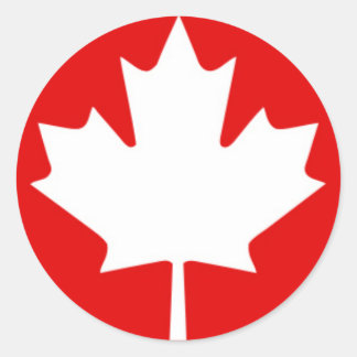 Wit esdoornblad op rode achtergrond ronde sticker