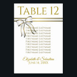 Wit & Goud Lint Bruiloft Zitkaarten Kaart<br><div class="desc">Maak uw huwelijksreceptie mooi met deze tafelnummerkaarten, en help uw gasten de juiste tafel te vinden. Voorzien van een eenvoudig maar elegant ontwerp met gouden tekst op een witte achtergrond met een afbeelding van een wit en gouden lint en boog. Elke kaart heeft ruimte om de gasten te vermelden die...</div>