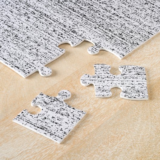 Wit lawaai. Zwarte en witte sneeuwgrijs. Legpuzzel (Zijkant)