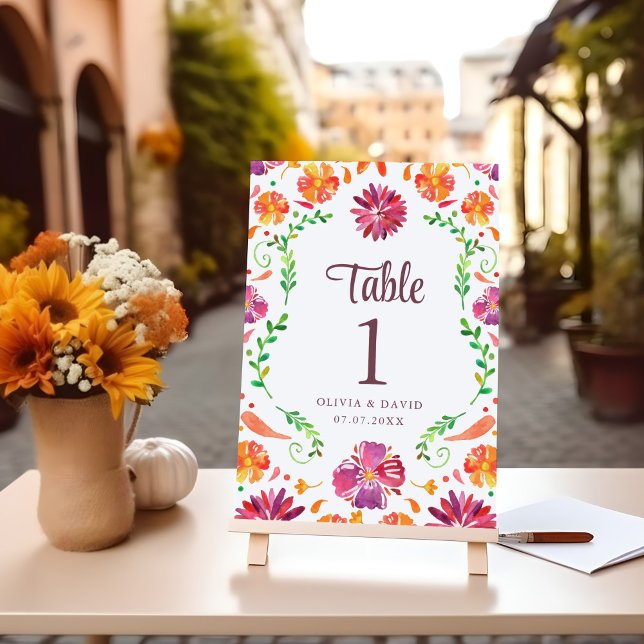 Wit Mexicaans Bloemen Fiesta Trouwtafel Nummer (White Mexican Floral Fiesta Wedding Table Number on a table with flowers.)