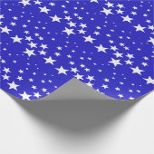 Wit sterpatroon op blauwe achtergrond cadeaupapier (Hoek)