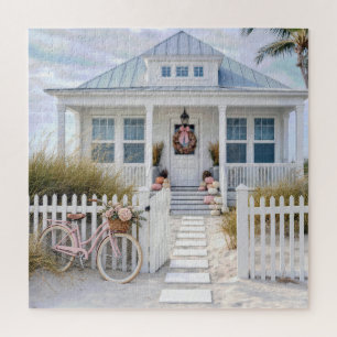 Wit strandhuisje met roze pompoenen en fiets legpuzzel