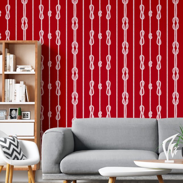Wit touw en matroos knopen patroon op rood behang (White rope and sailor's knots pattern on red wallpaper)