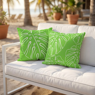Wit tropisch bladmotief op limoengroen buitenkussen