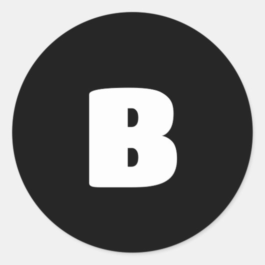 Wit vet initiaal op zwart ronde sticker (Voorkant)