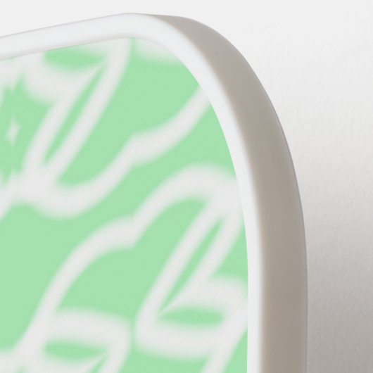 Witte abstracte vormen op groen pickleball paddle (Links Detail)