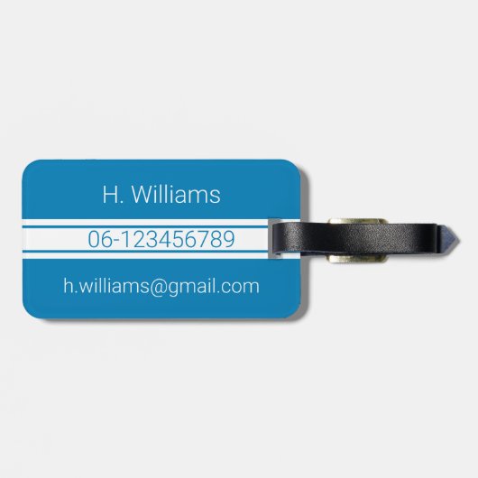 Witte band en ovaalschild met monogram op blauw bagagelabel (Achterkant horizontaal)