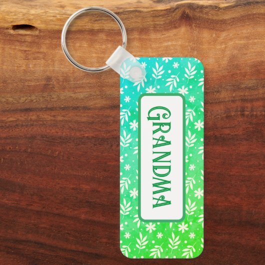 Witte blaadjes op groene Sleutelhanger (Voorkant)