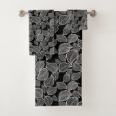 Witte bladeren op zwarte handdoek (Insitu)