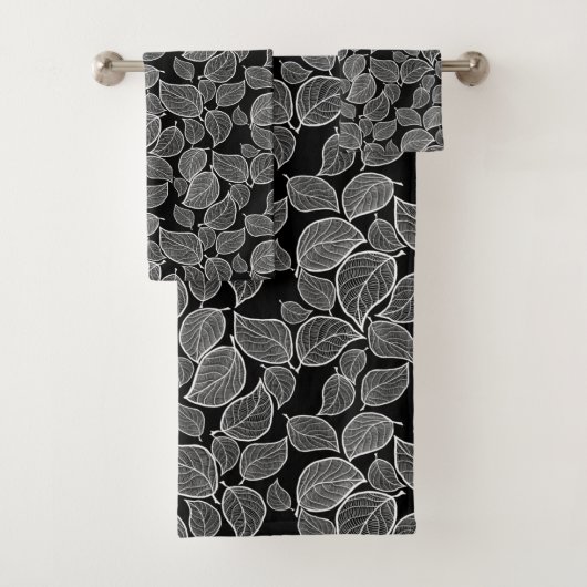 Witte bladeren op zwarte handdoek (Insitu)