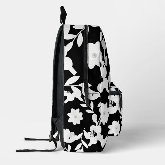 Witte bloemen met parels op zwart bedrukte rugzak (Links)