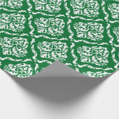 Witte bloemendamast patroon op groen cadeaupapier (Hoek)