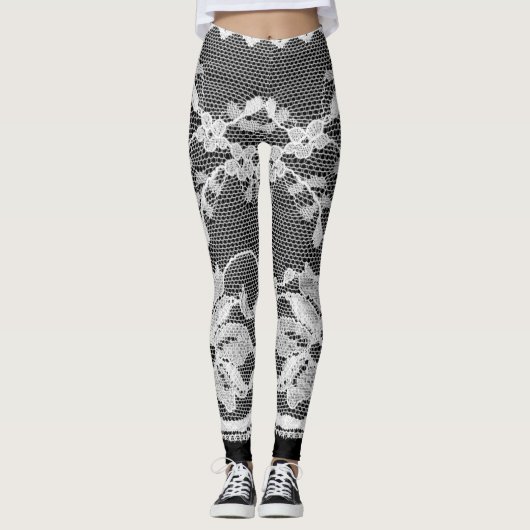Witte bloemenkant: zwarte achtergrond. leggings (Voorkant)