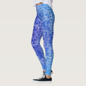 Witte bloemenpatroon print op blauw leggings (Links)