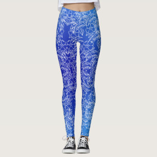 Witte bloemenpatroon print op blauw leggings