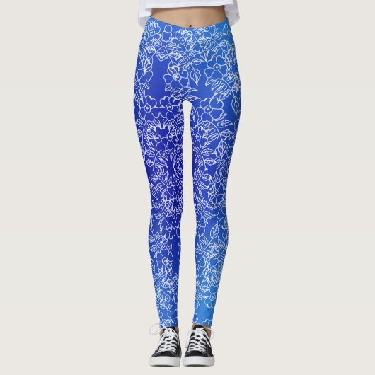 Witte bloemenpatroon print op blauw leggings (Voorkant)