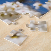 Witte bloesem blauwe lucht achtergrond legpuzzel (Zijkant)