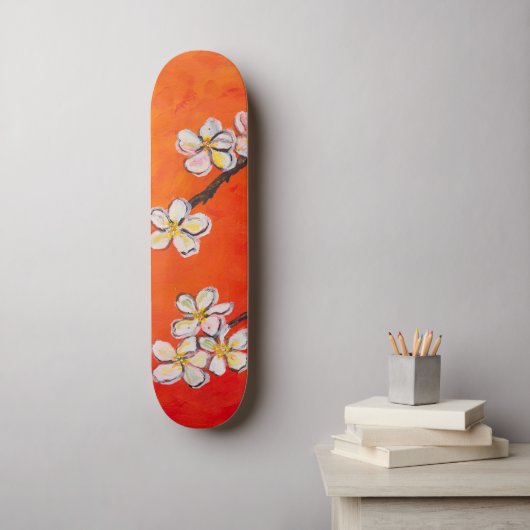 Witte bloesems op oranje rode lente achtergrond persoonlijk skateboard (Muurkunst)