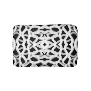 Witte buisleidingen op zwart badmat