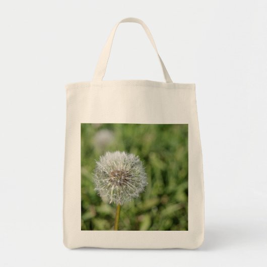 Witte dandelion bloem op groen gras tote bag (Voorkant)