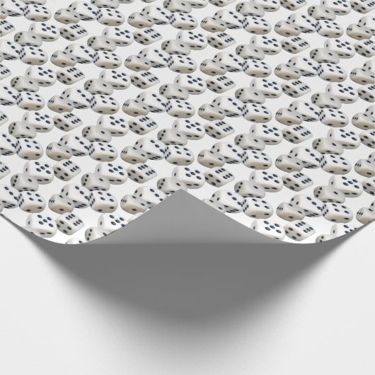 Witte dobbelstenen op wit cadeaupapier (Hoek)