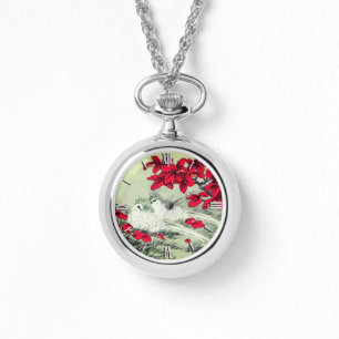 witte doven en rode bladeren op grijs horloge