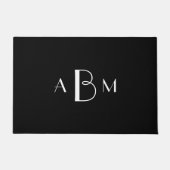 Witte drie initialen monogram op zwart deurmat (Voorkant)