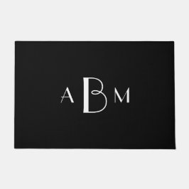 Witte drie initialen monogram op zwart deurmat