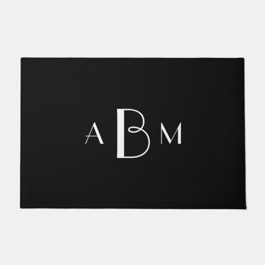 Witte drie initialen monogram op zwart deurmat (Voorkant)
