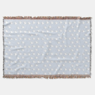 Witte duiven op bleek blauw deken