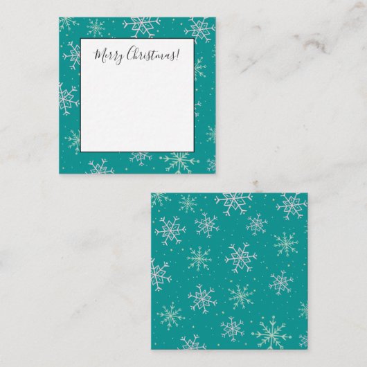 Witte en aquablauwe sneeuwvlokken op een turquoise notitiekaartje (Voorkant / Achterkant)