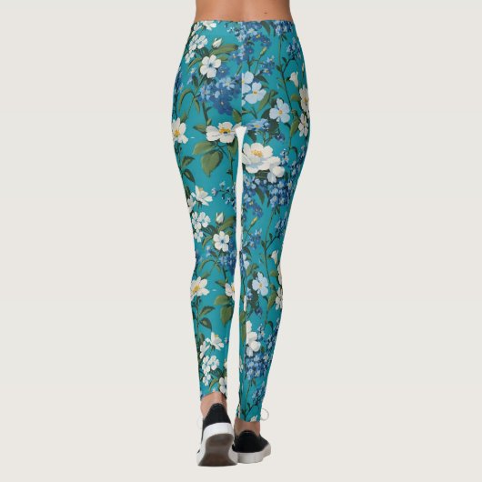 Witte en Blauwe Bloemen met Blauwgroen achtergrond Leggings (Achterkant)
